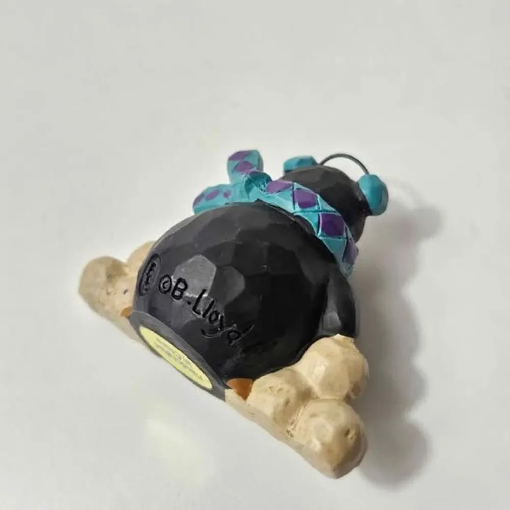B. Lloyd Penguin Figurine 